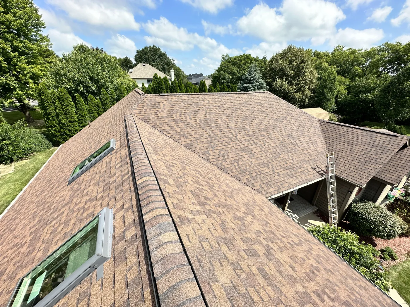 new brown shingle roof with skylights apex exteriors