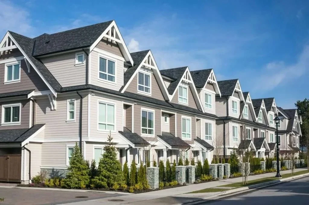 Row of well-maintained townhomes with clean, functional gutter systems, representing Apex Exteriors’ commitment to ongoing service, routine maintenance, and responsive gutter repairs for multi-family properties across Chicagoland.