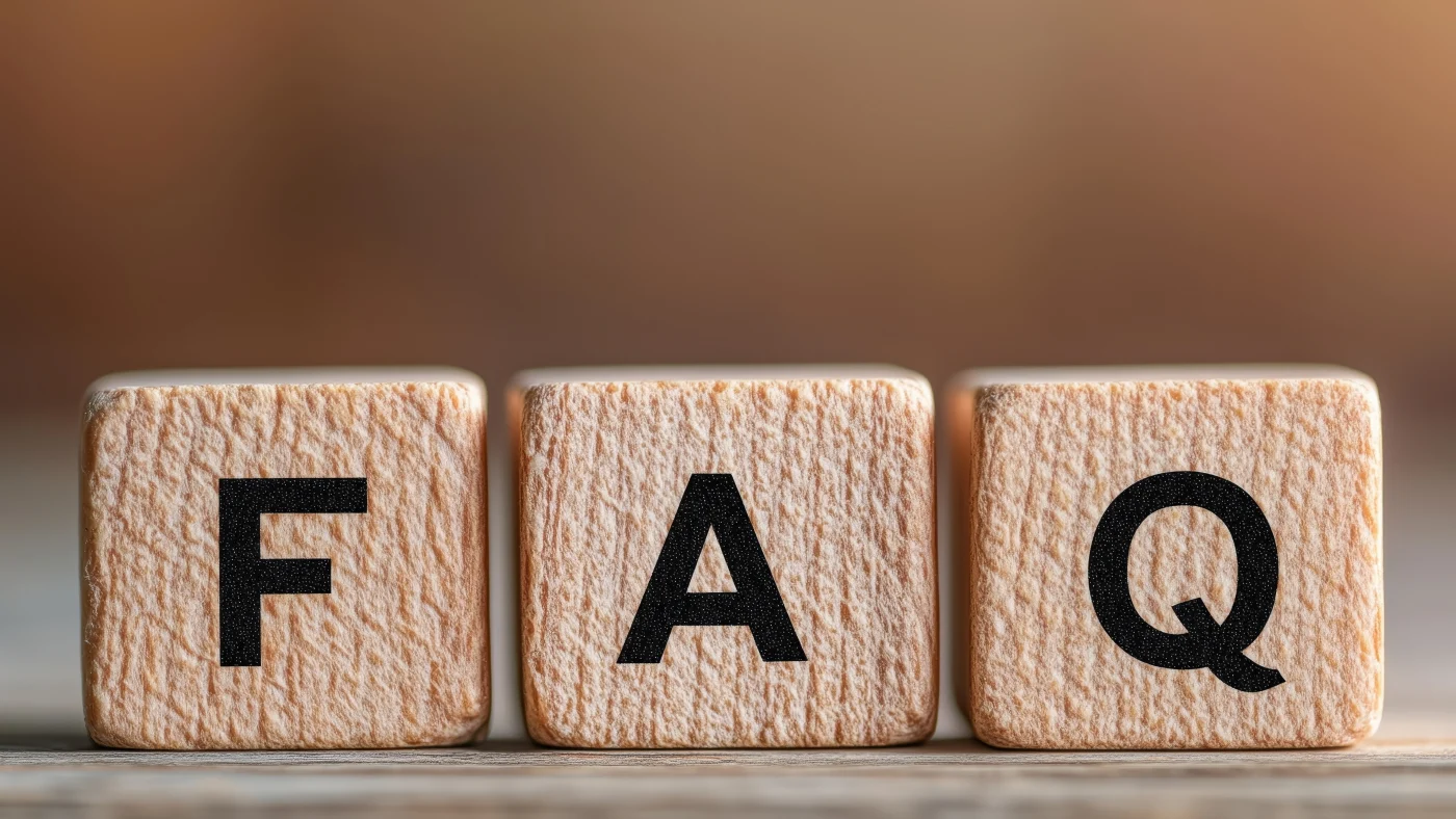 Apex Exteriors Company FAQs – Exterior Services Across The Chicagoland Area A close-up photo of three light wooden blocks arranged side by side, each engraved with a bold black letter to spell "FAQ." The blocks sit on a smooth surface, with a softly blurred, warm-toned background that creates a clean and professional look. The wood grain texture is clearly visible, giving the image a natural and approachable feel—ideal for introducing a Frequently Asked Questions section.