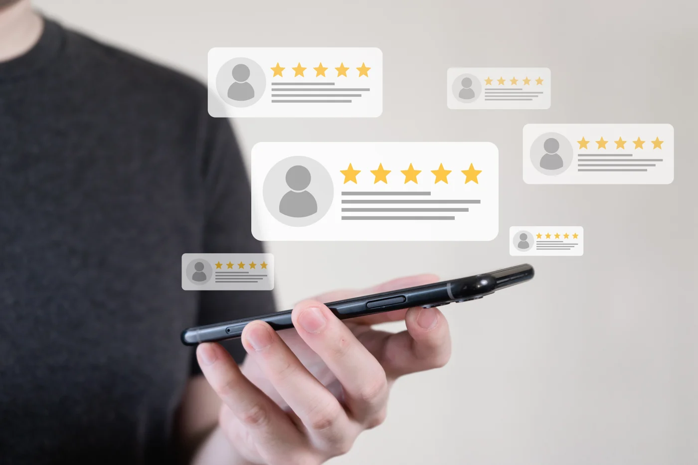 Apex Exteriors Has Hundreds Of Reviews From Home & Business Owners A close-up of a smartphone in a young man’s hand with six small icons floating in the air above it that symbolize profiles leaving five-star reviews online.