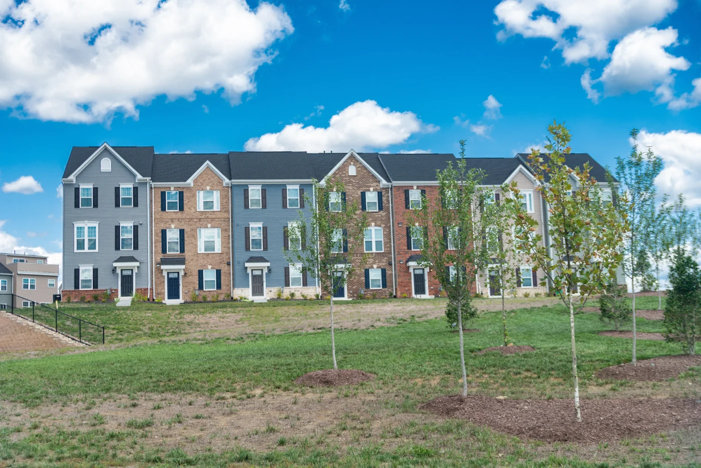 Multi Family Homes In A Large Community. Modern Bricks Townhouse