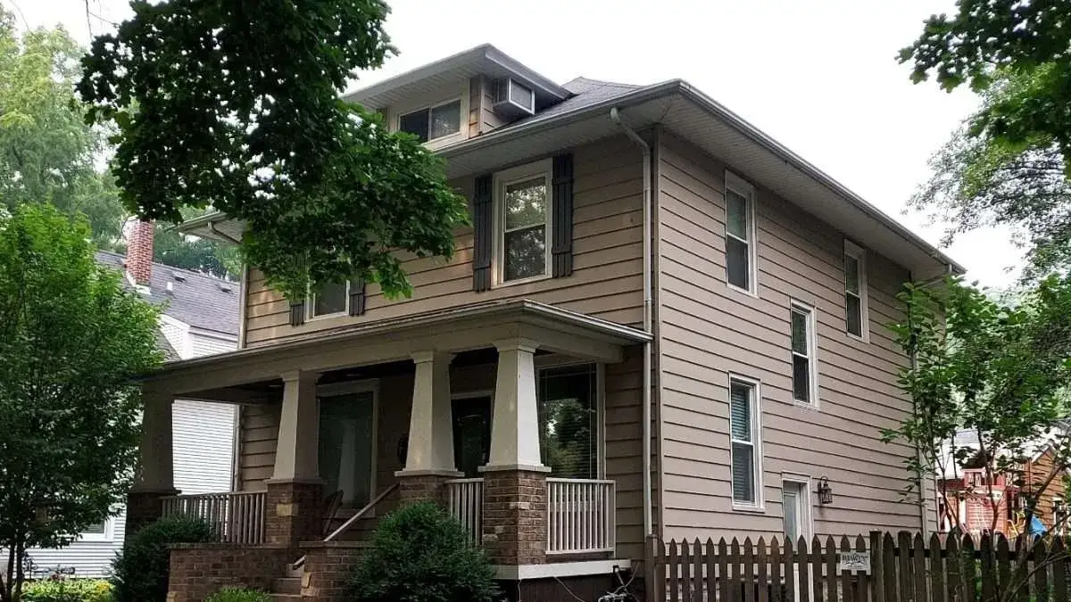 Angled full view of Ashley and Ian’s home prior to siding replacement