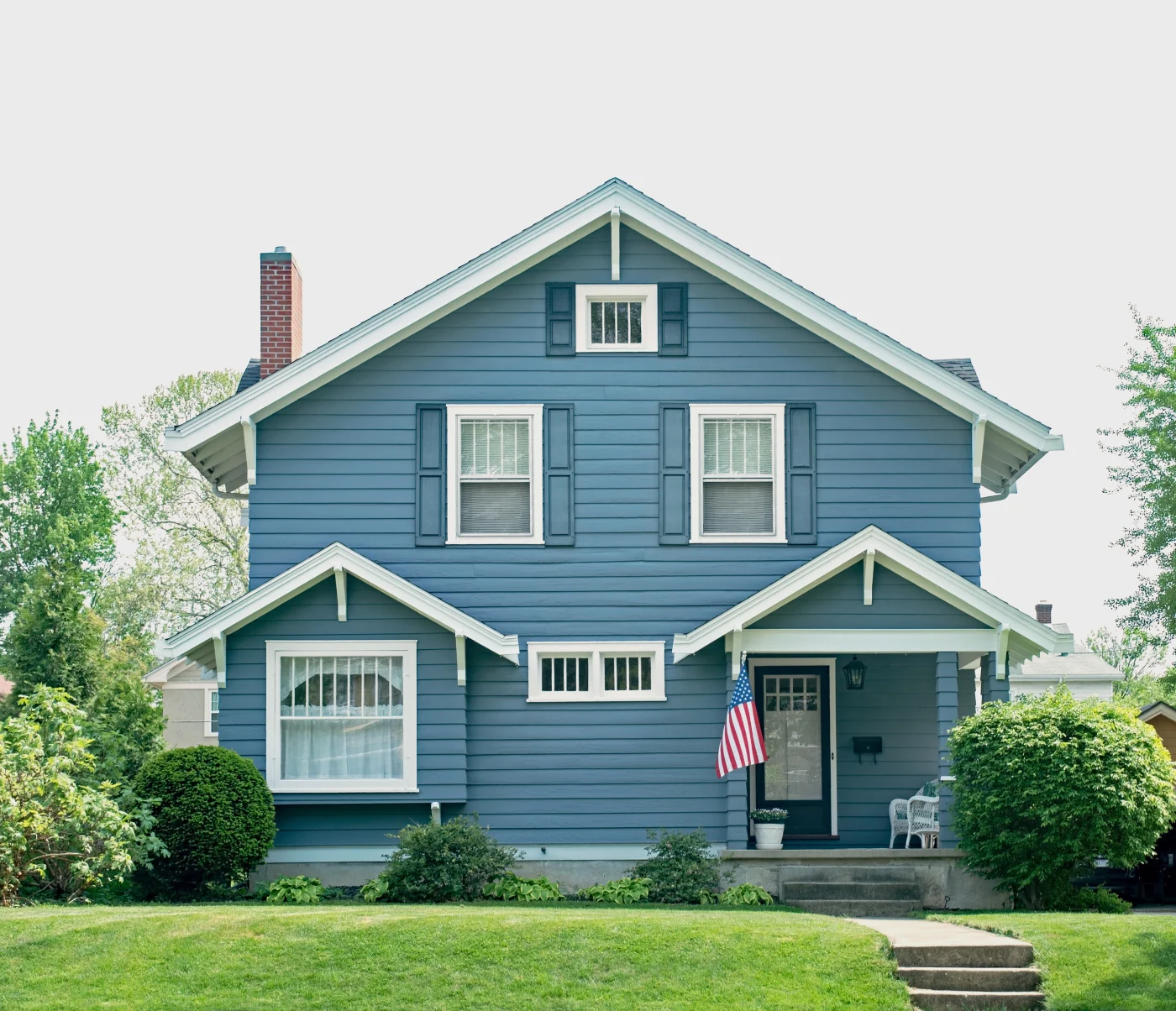 Beautiful siding on a dark blue house with white trim