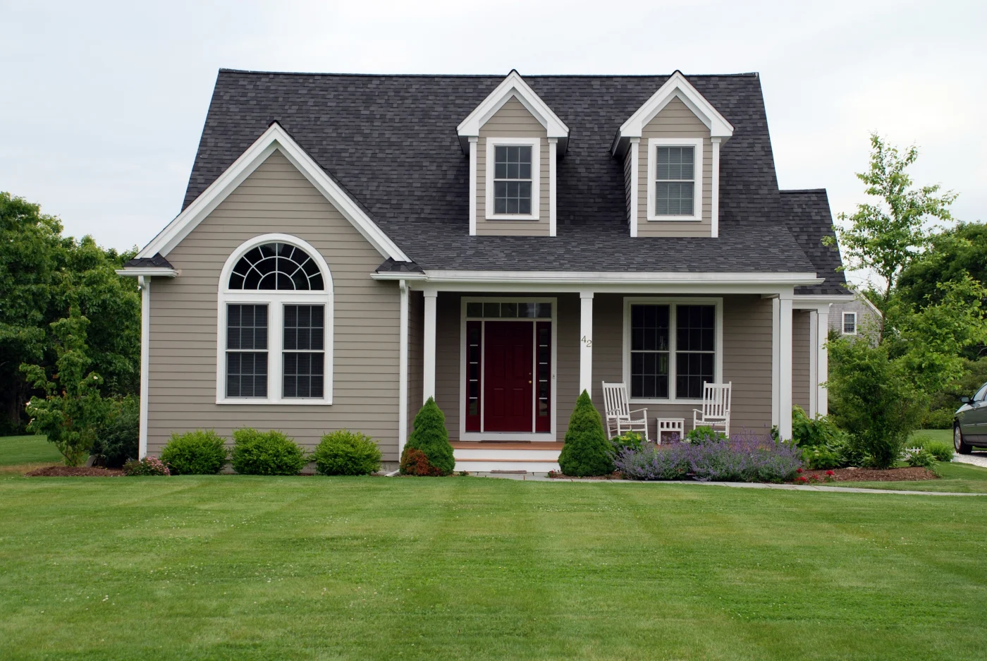Two-story house with siding and a asphalt shingle roof