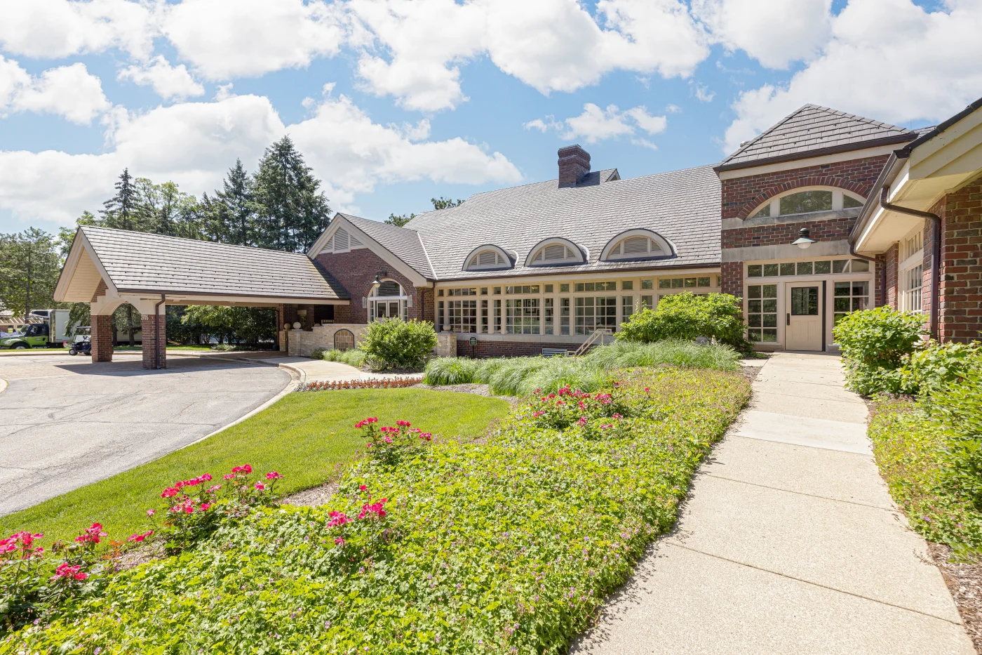 Image of a large brick building with a newly installed roof