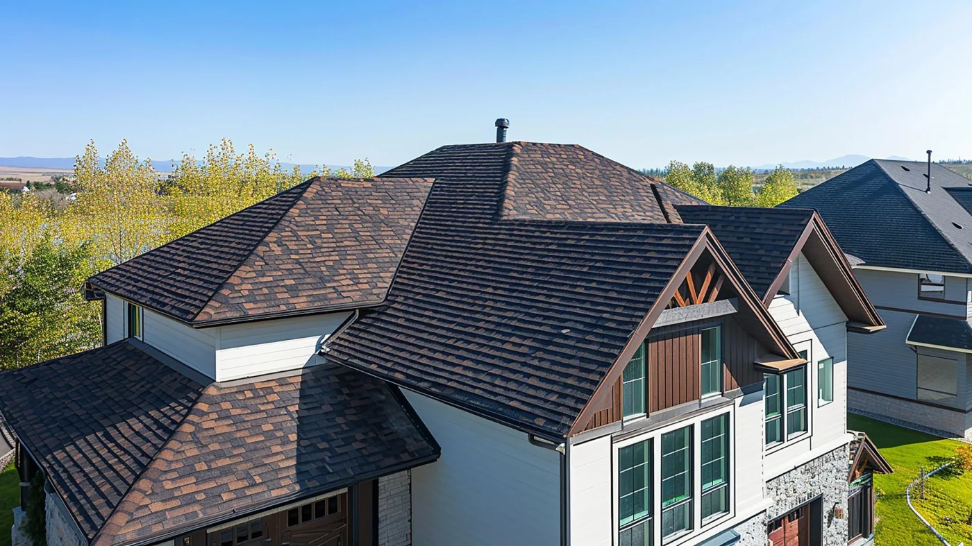 Drone view of home with white exterior and brown asphalt shingle roof