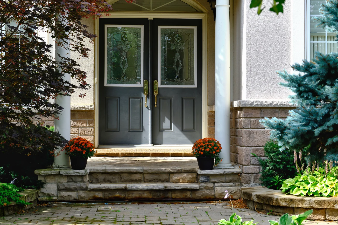 Image of dark-colored double-entry doors with large glass inserts