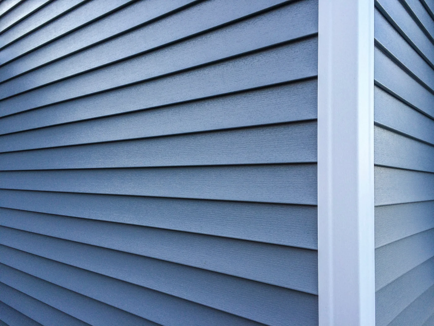Close up of blue siding on a house