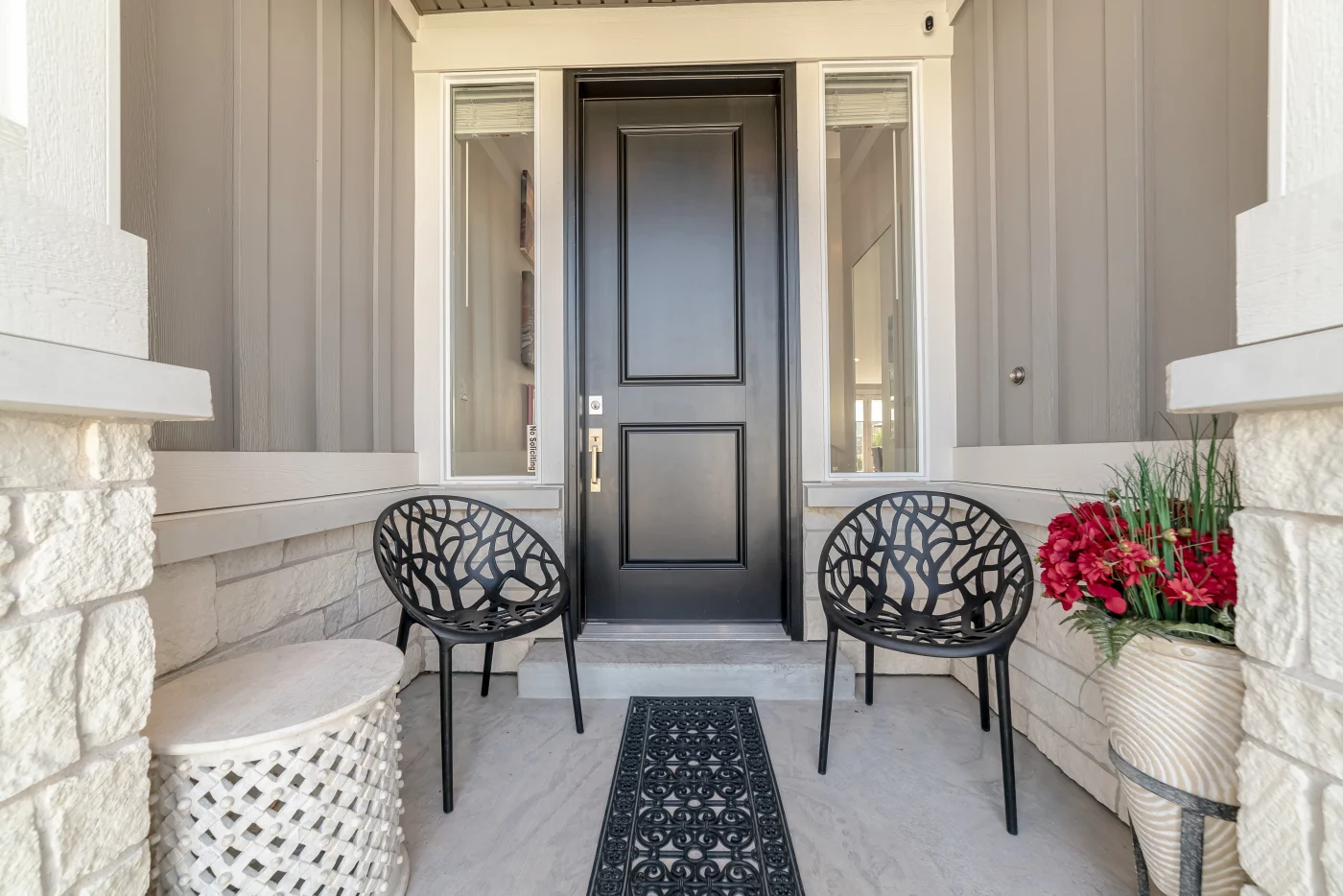 Homeowners sit at a table with HOA members as they discuss their home.