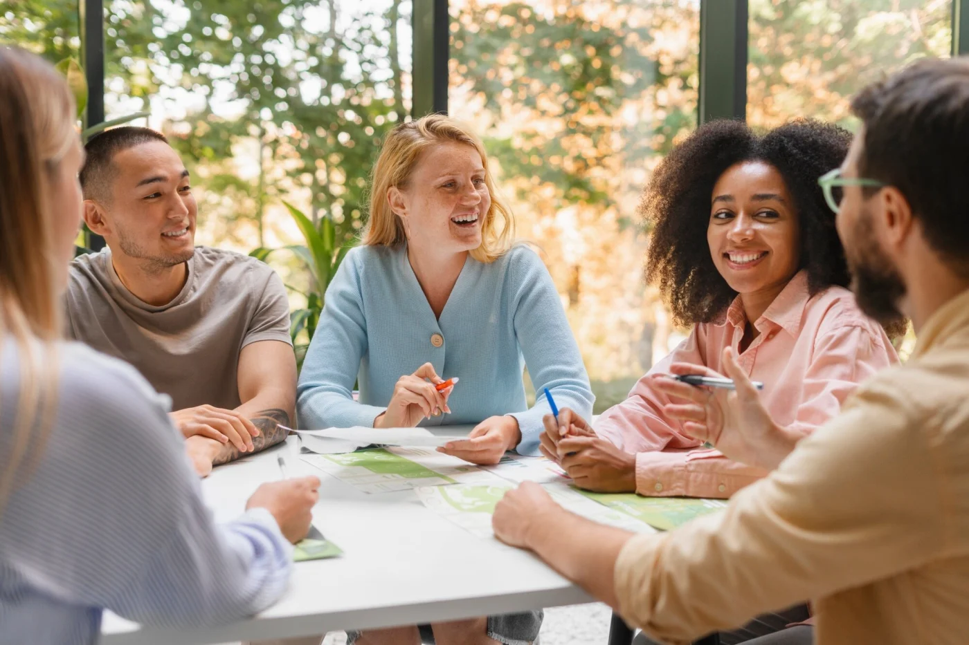 A group of friendly HOA members meet at a table.