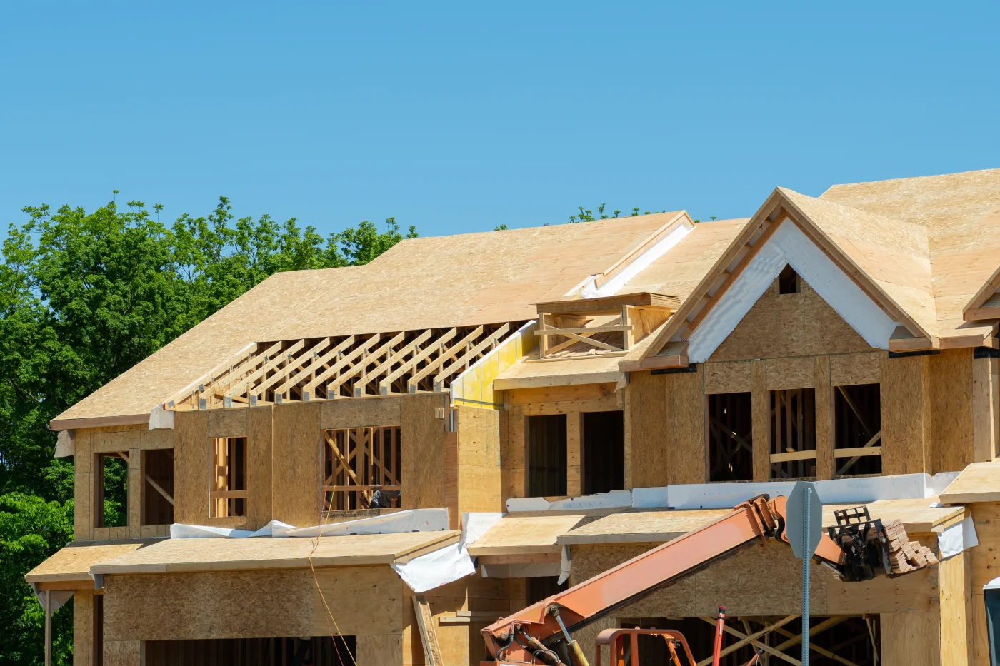 House under construction under blue sky