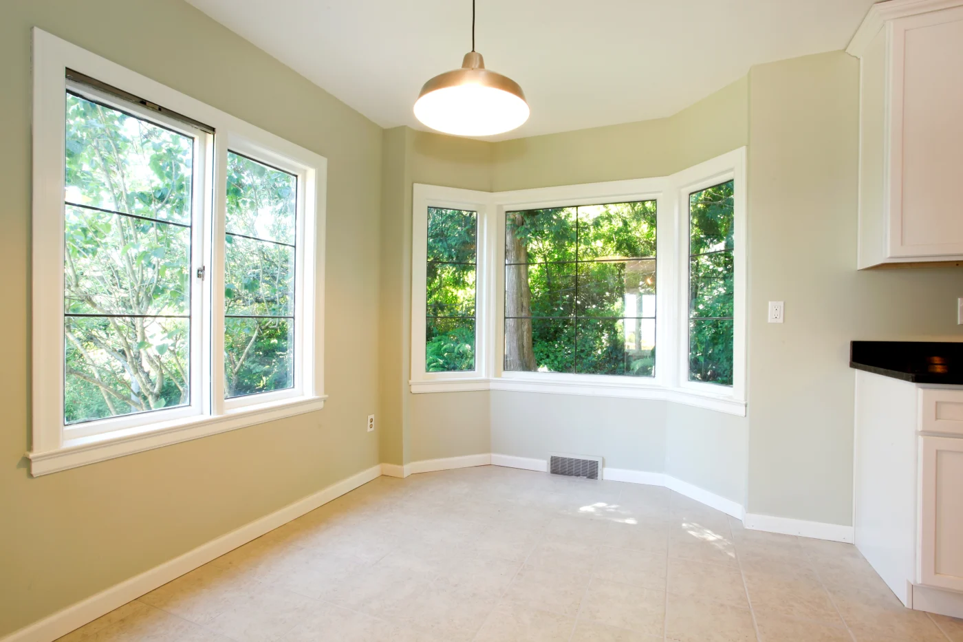 Beautiful new bay windows in an empty dining room