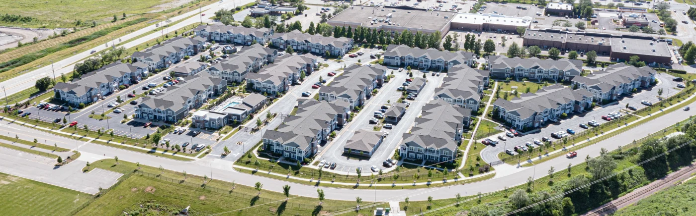 A drone shot capturing an apartment complex with stunning new roofs.