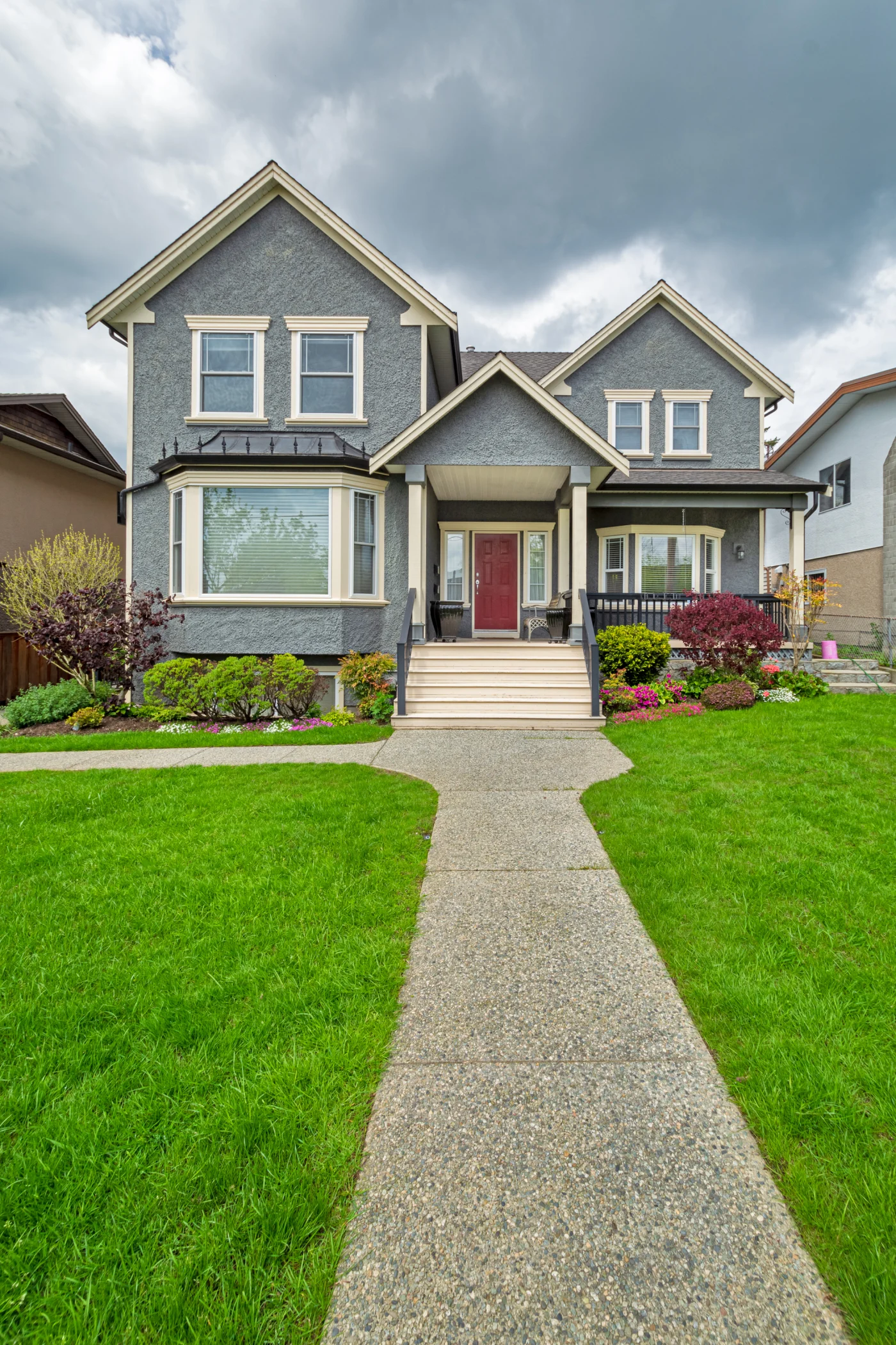 Nice Family House With Concrete Pathway Over Green Lawn Over Front Yard