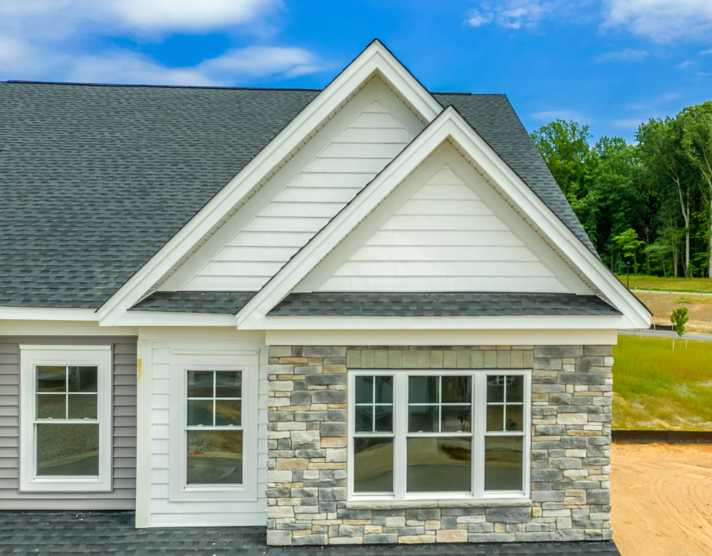 Engineered stone veneer siding on a house