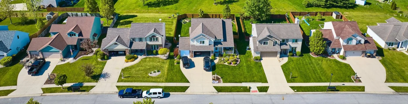 Far-off image of a row of homes in a neighborhood