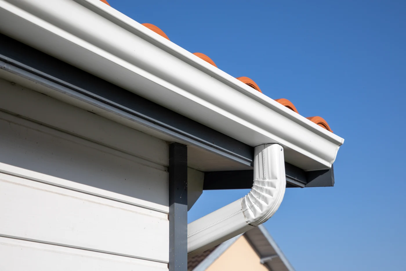 White aluminum gutters installed on home