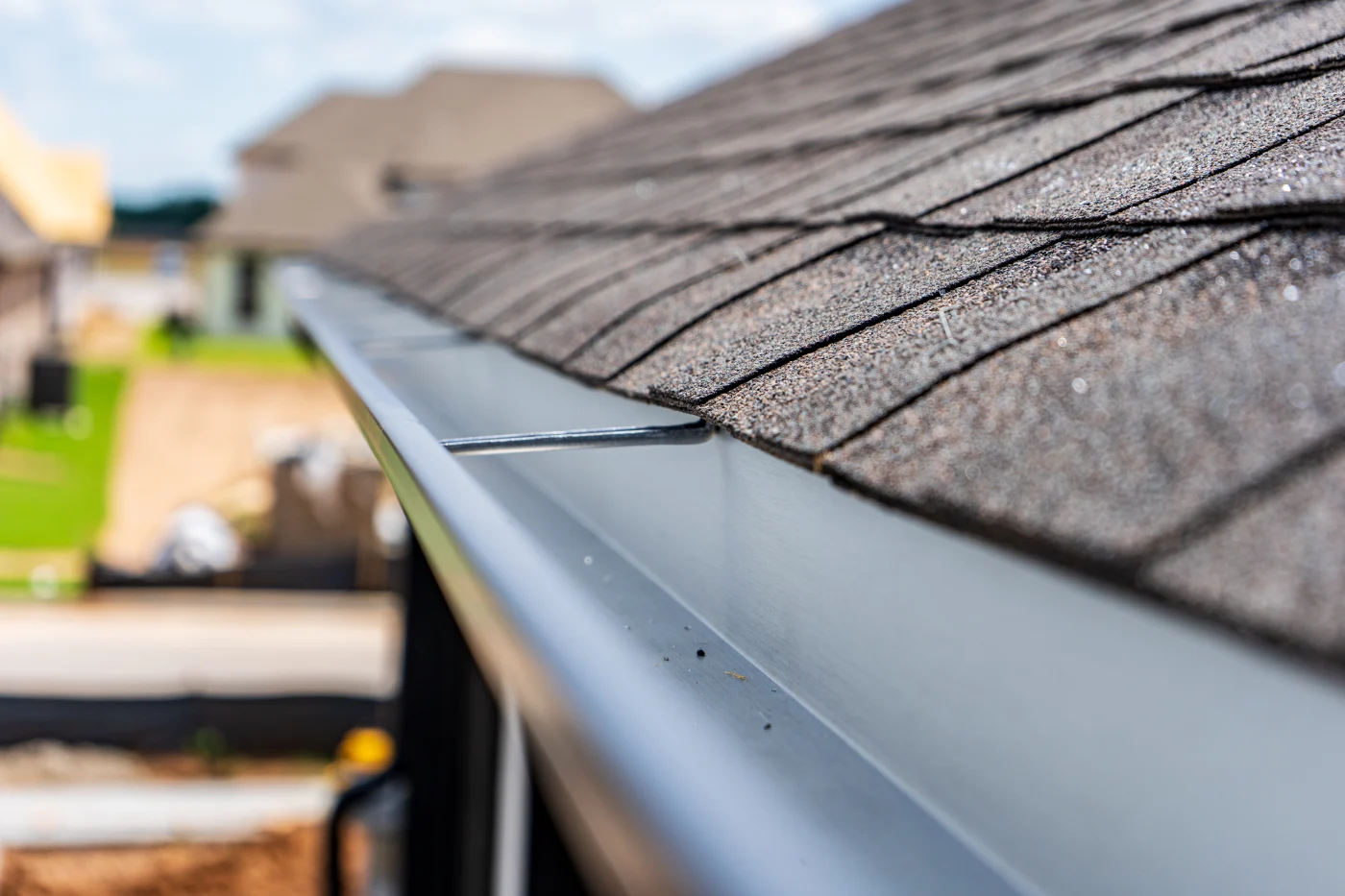 Expert roofers installing premium shingles on a new roof