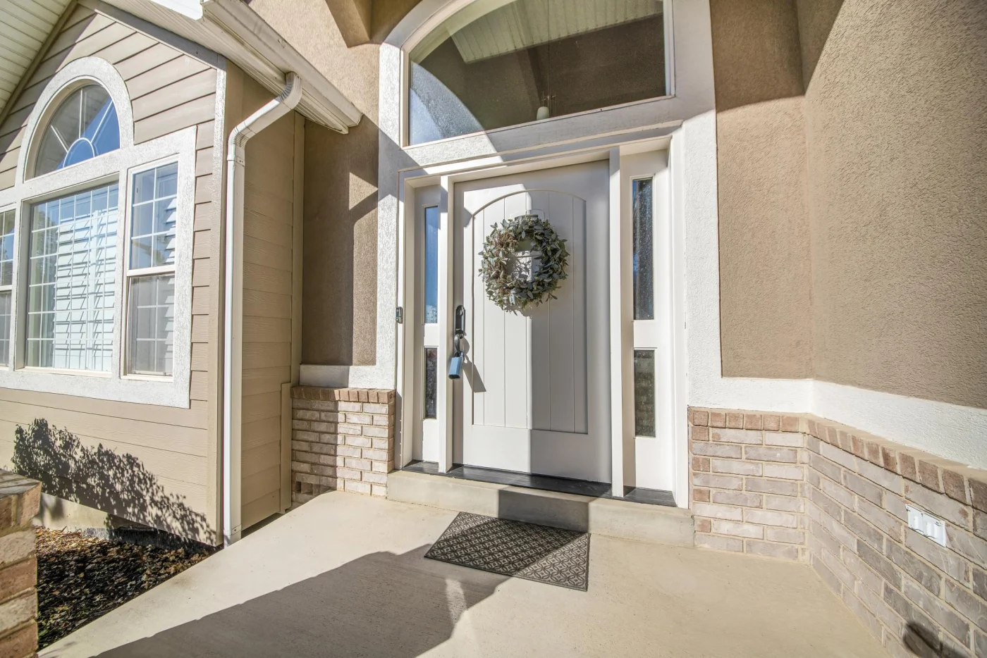Beautiful white entry door with sidelights