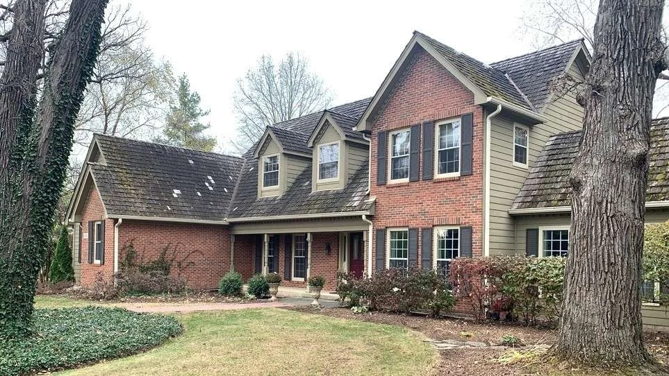 A wide view of John’s rundown roof prior to his roof replacement project