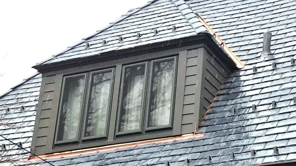 Close view of one of John’s redone dormers with copper flashing in place