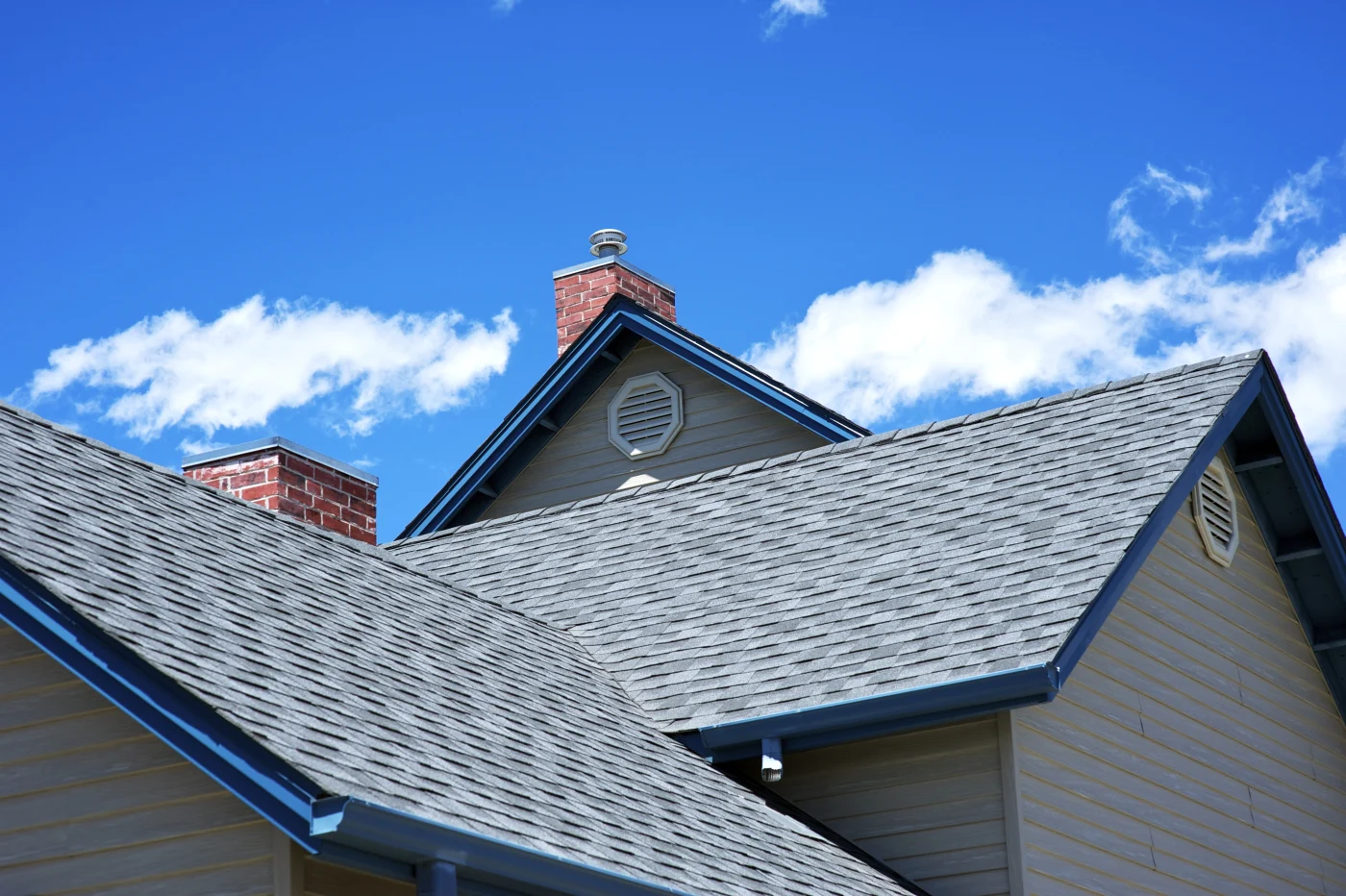 Close-up image of a large roof on a dark grey house