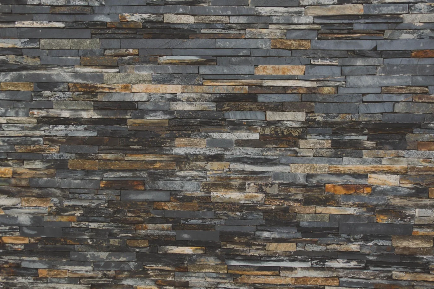 A close-up photo of engineered stone veneer siding.