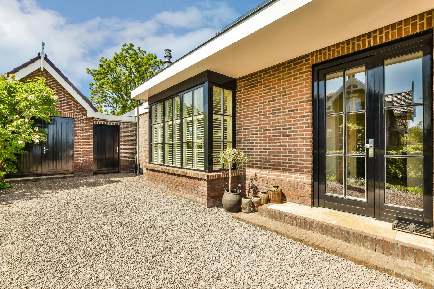 Stunning brick home with modern black windows and doors in Glenview, IL.