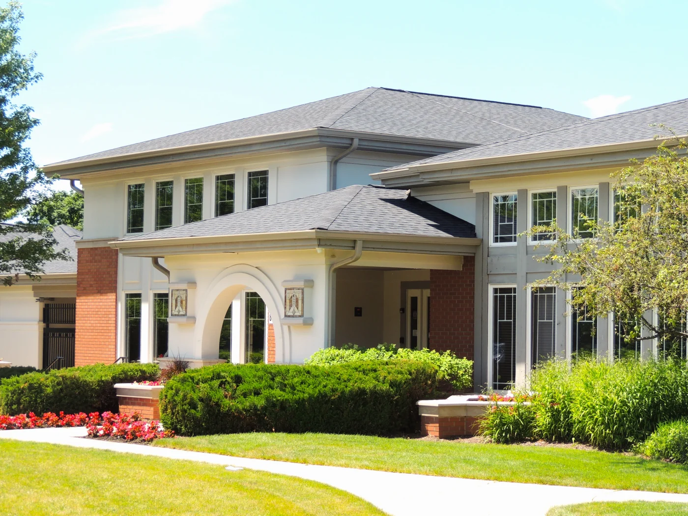 Commercial community clubhouse with new asphalt shingle roof provided by Apex Exteriors