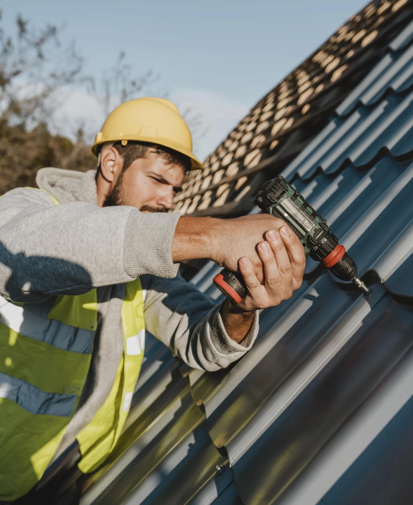 Image of a man installing a roof