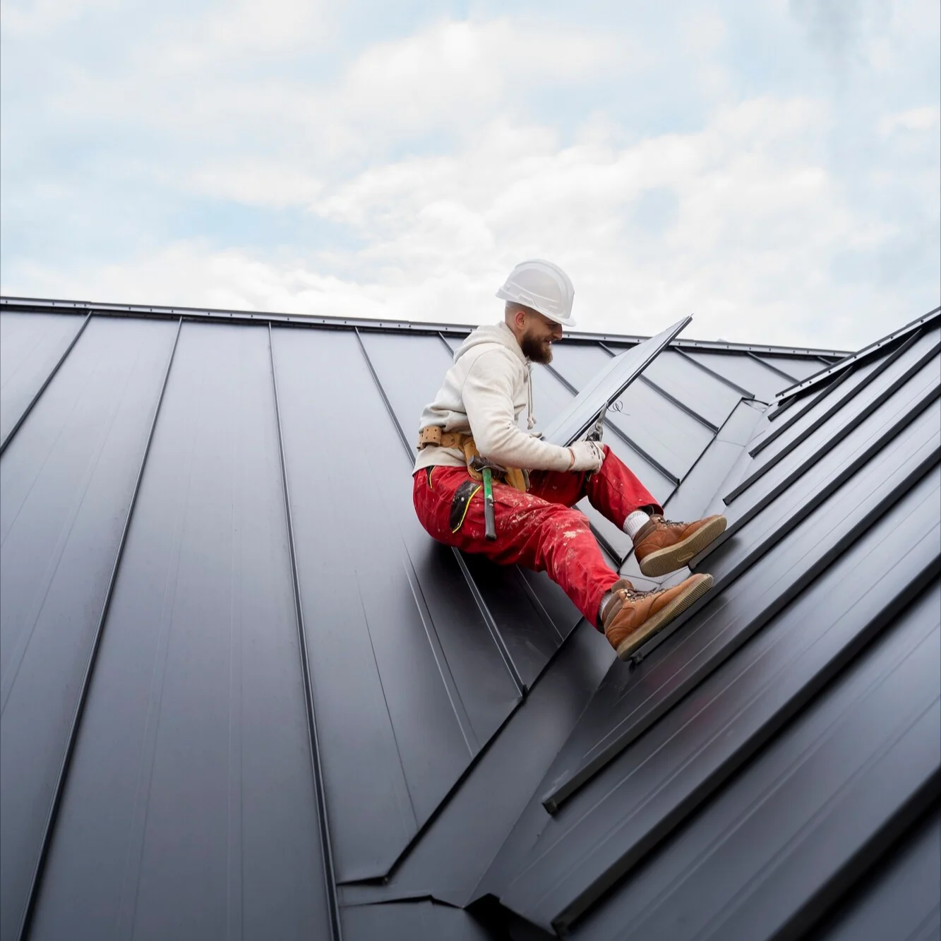 Image of a man repairing a metal roof