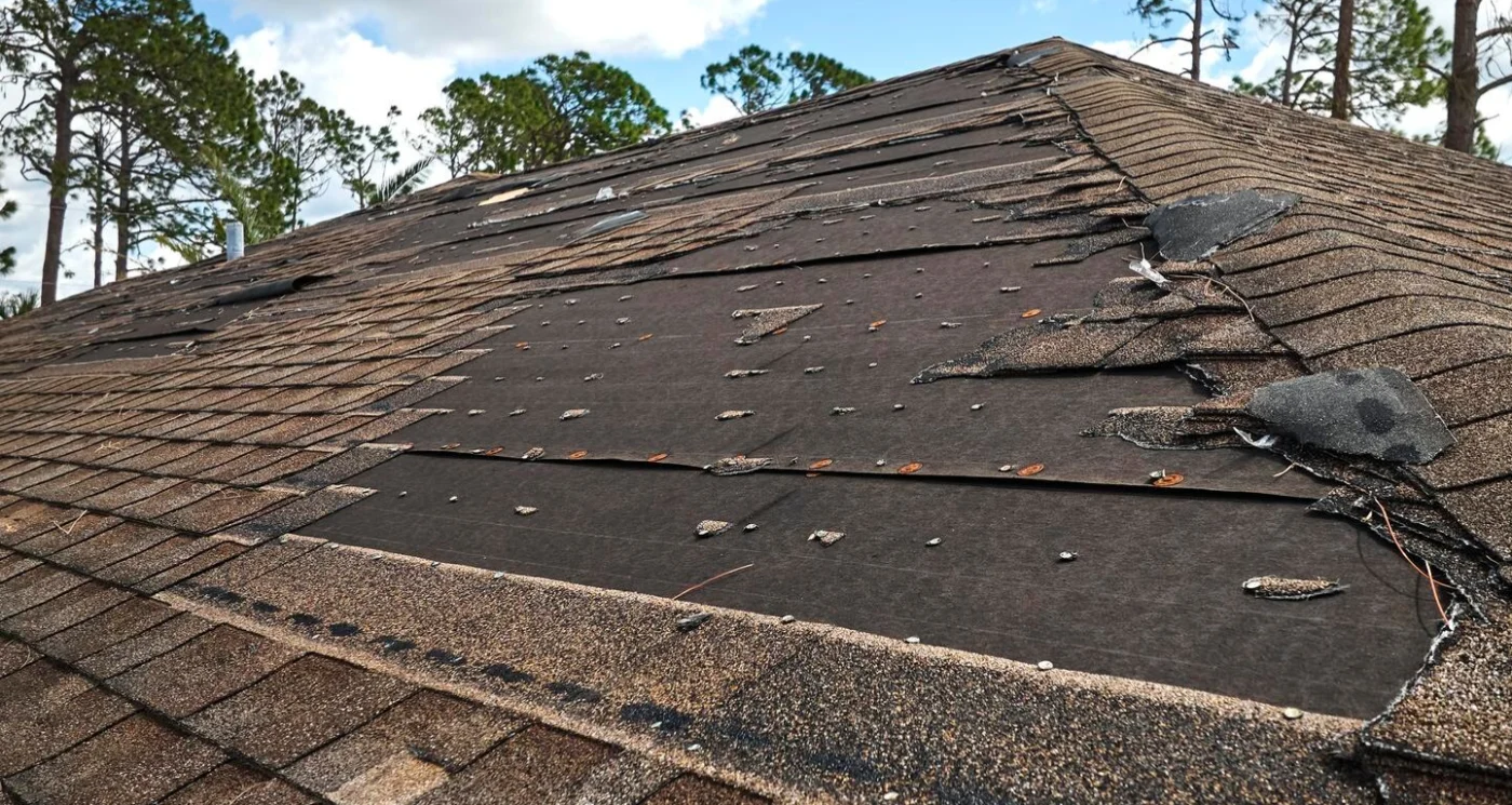 Close-up image of a roof with missing shingles
