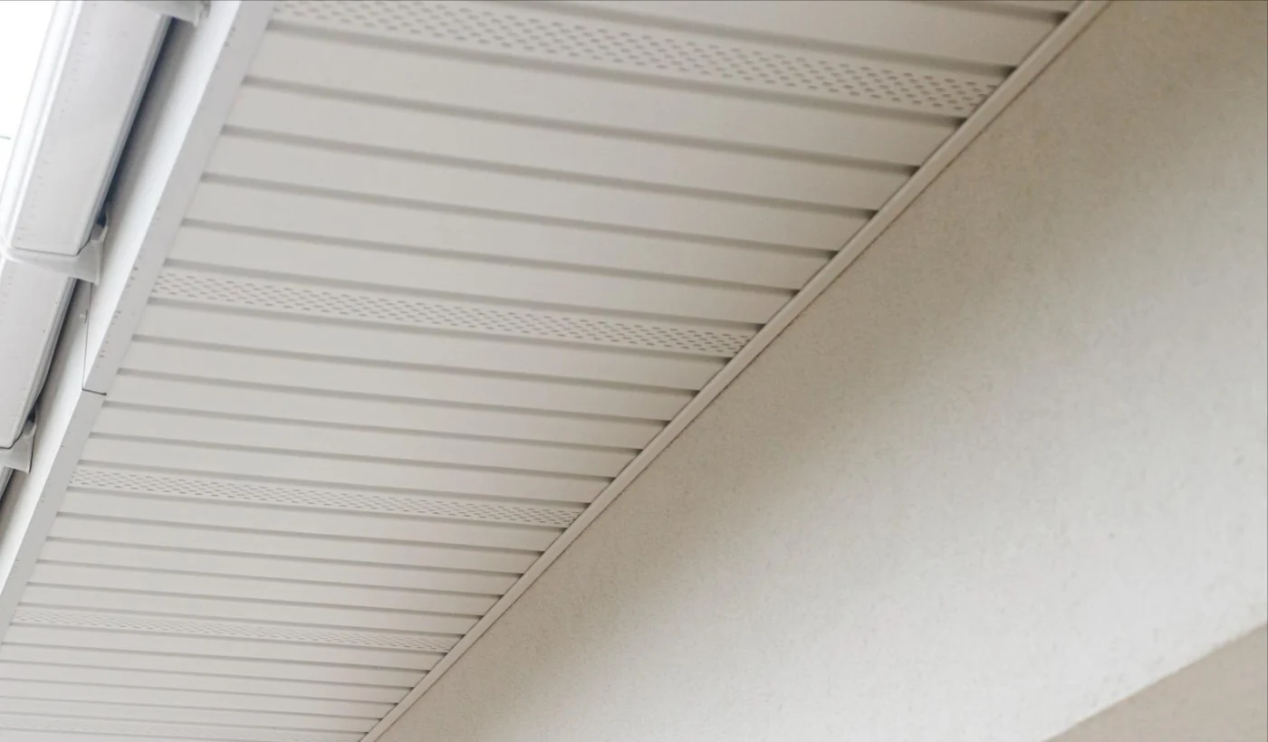 A close-up image of white soffits on a house
