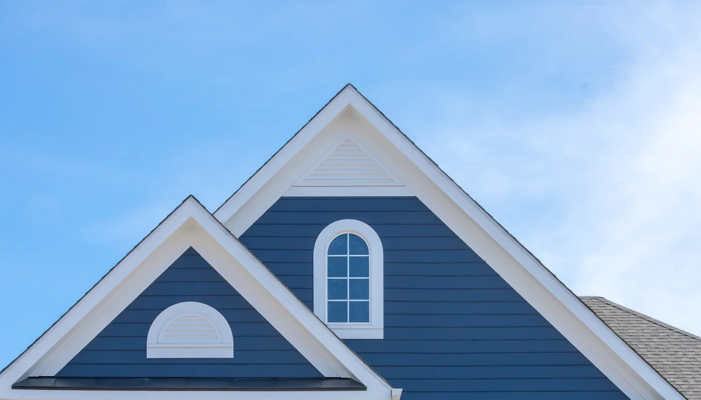 Stunning siding on the top of a blue house