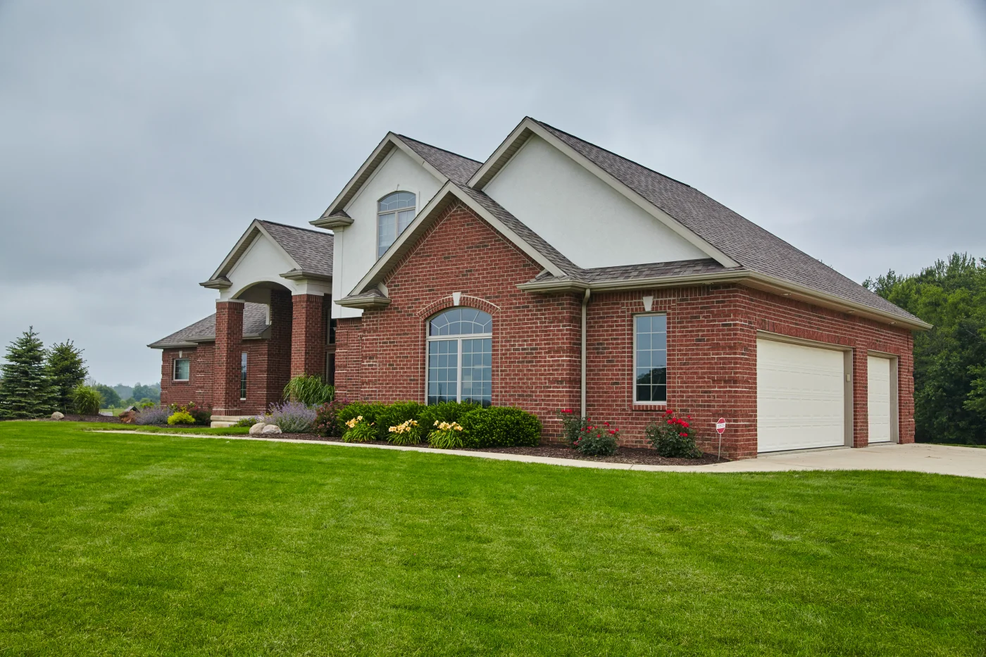 Red brick home with beautiful new windows installed