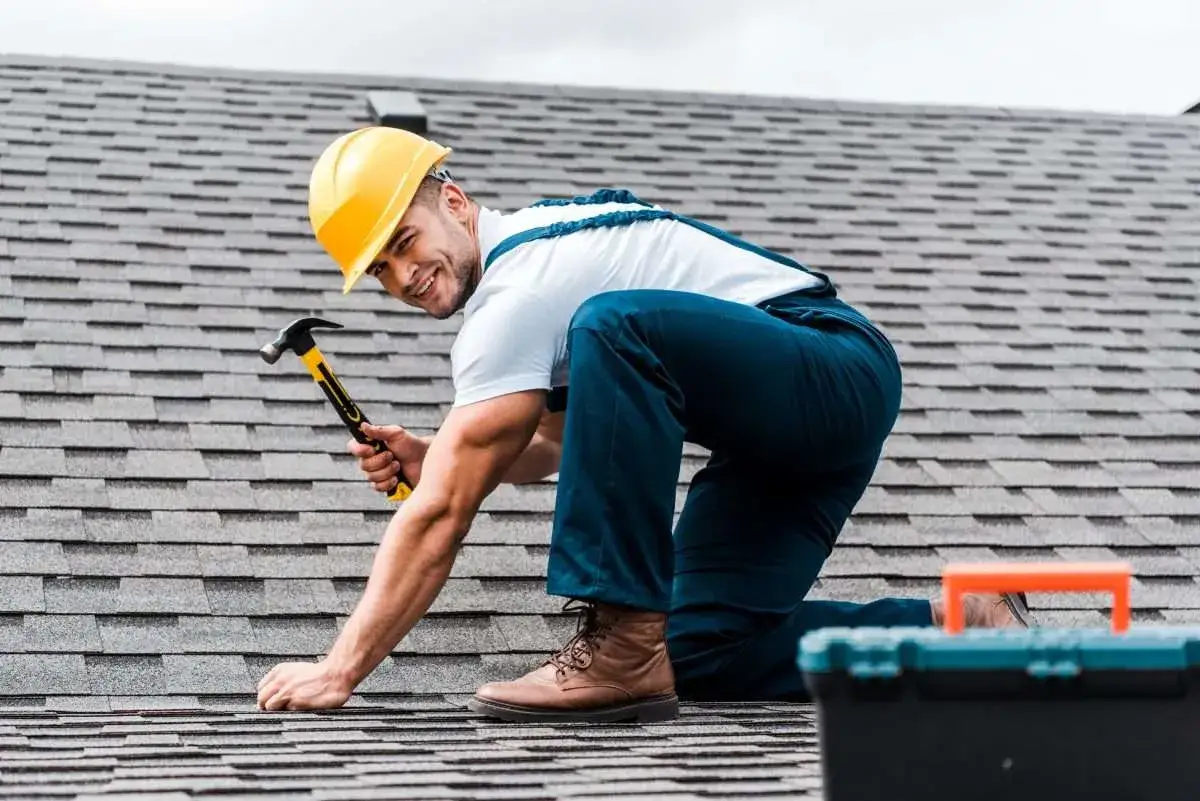 A 2-story home stands proud with its recently repaired roof.