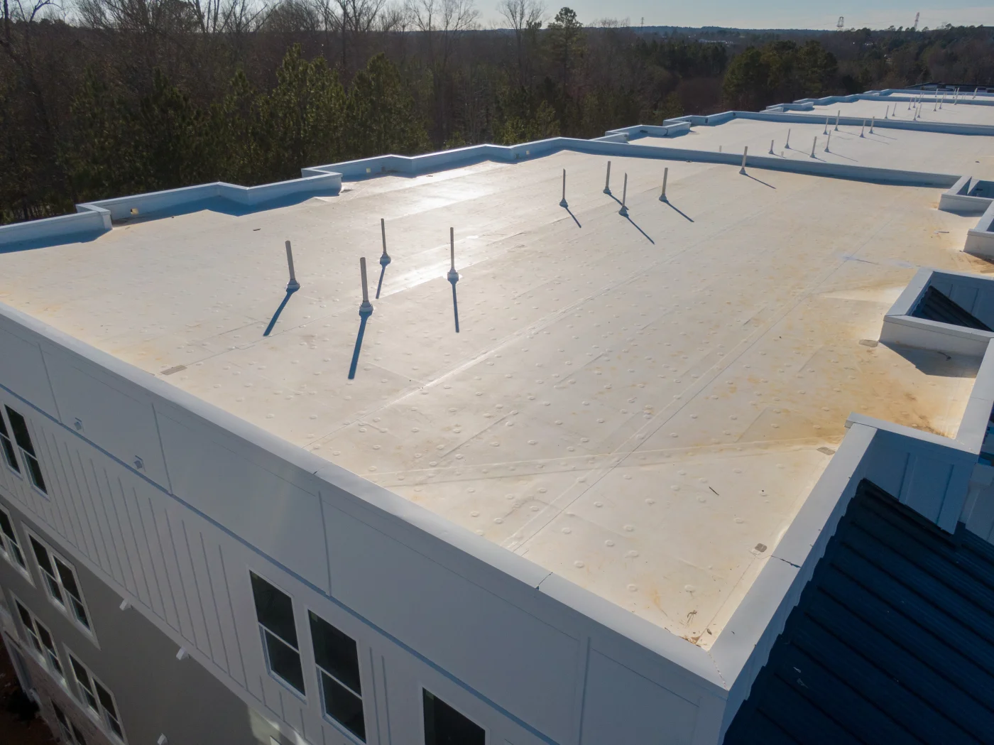 White flat roof on a commercial office building