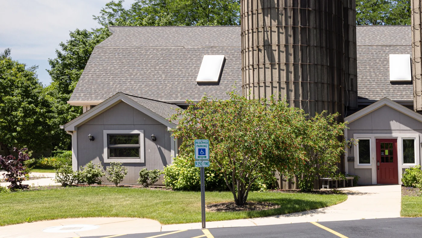 A commercial building with a light brown roof in Lombard, IL by Apex Exteriors.