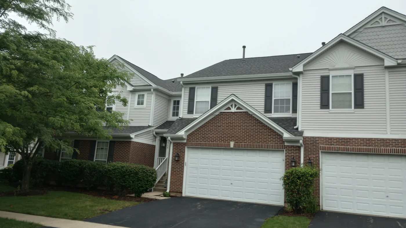 The front of a house with different types of siding in Bloomingdale, IL by Apex Exteriors.