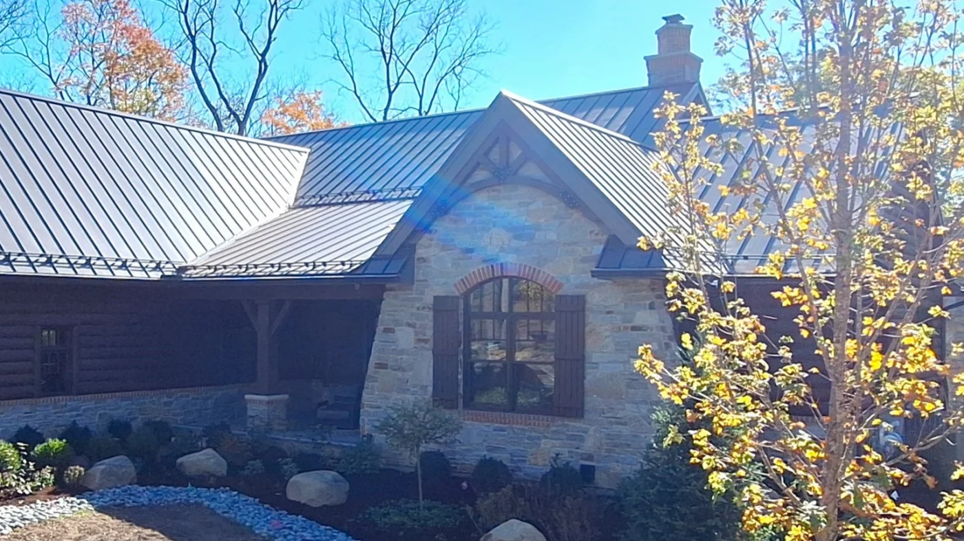 A side of a home with light brown brick and brown vinyl siding in LaGrange, IL by Apex Exteriors.