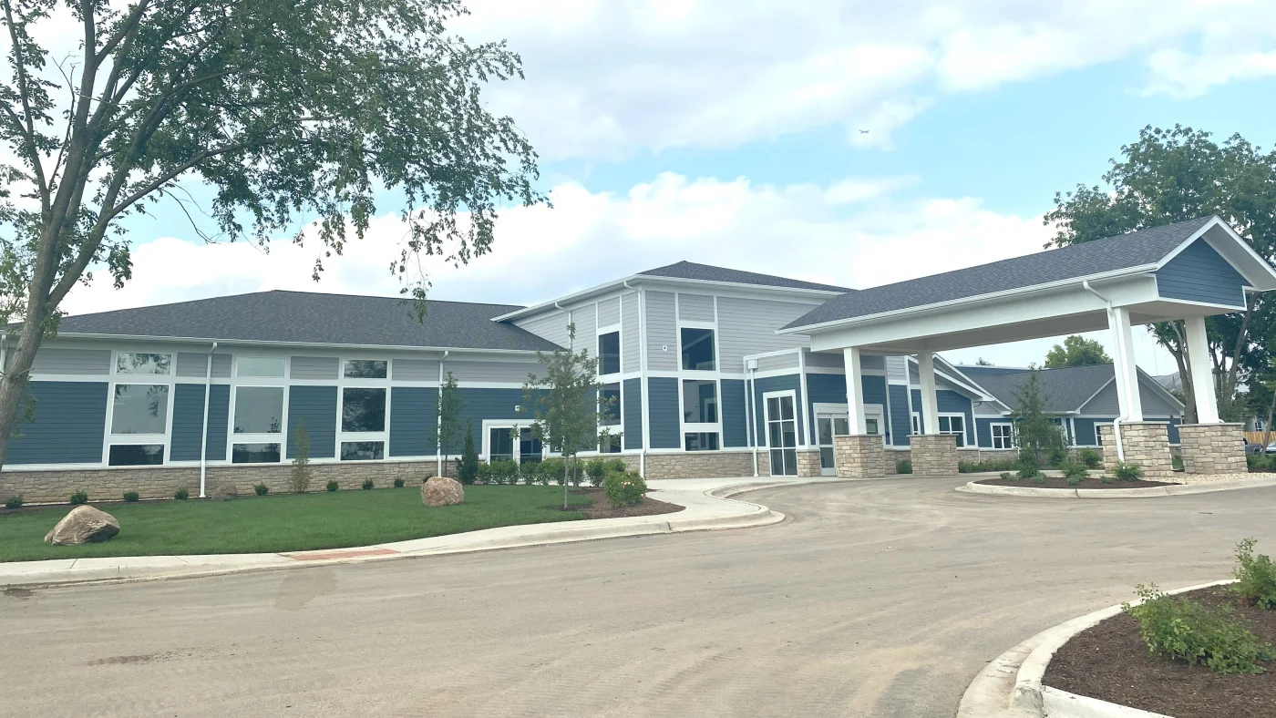 A commercial building with light gray and blue siding with white trim in LaGrange, IL by Apex Exteriors.