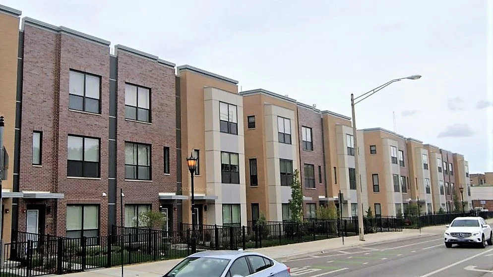 A row of apartment buildings on a street in Glenview, IL by Apex Exteriors.