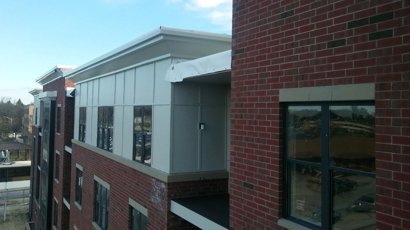 A side view of the top of a commercial building's new roof in Glenview, IL by Apex Exteriors.