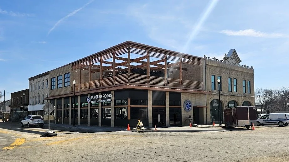 A view across the street of a commercial building under additional construction in Lombard, IL by Apex Exteriors.
