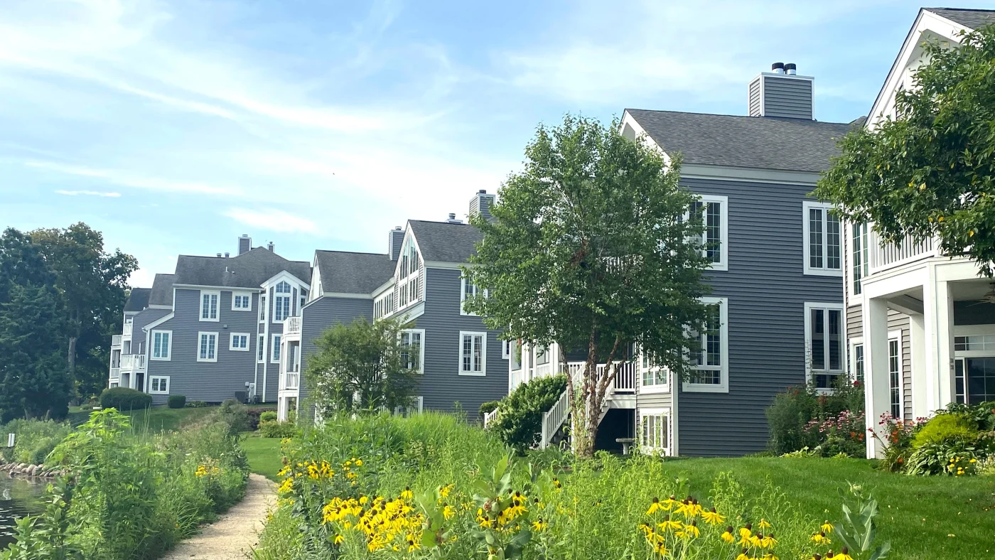 Multiple houses with gray siding and white trim in LaGrange, IL by Apex Exteriors.