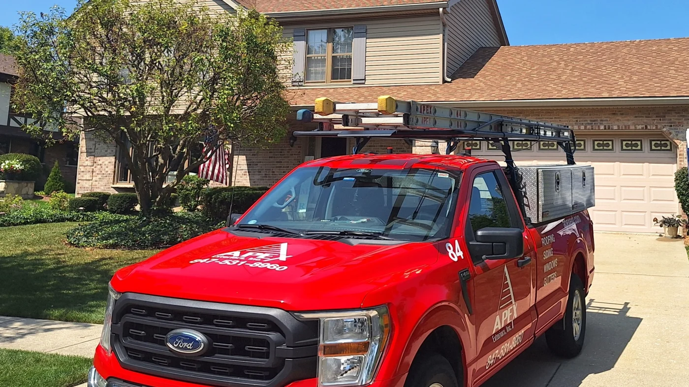 An Apex Exteriors truck parked in the driveway of a home in LaGrange, IL.