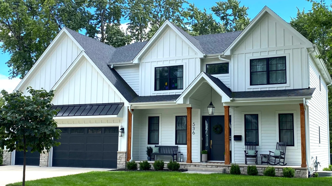 A large house with white siding in Glenview, IL by Apex Exteriors.