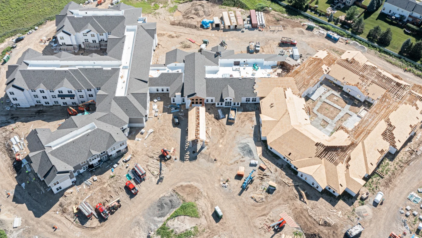 A high-up sky view of a large retirement complex under construction in LaGrange, IL by Apex Exteriors.