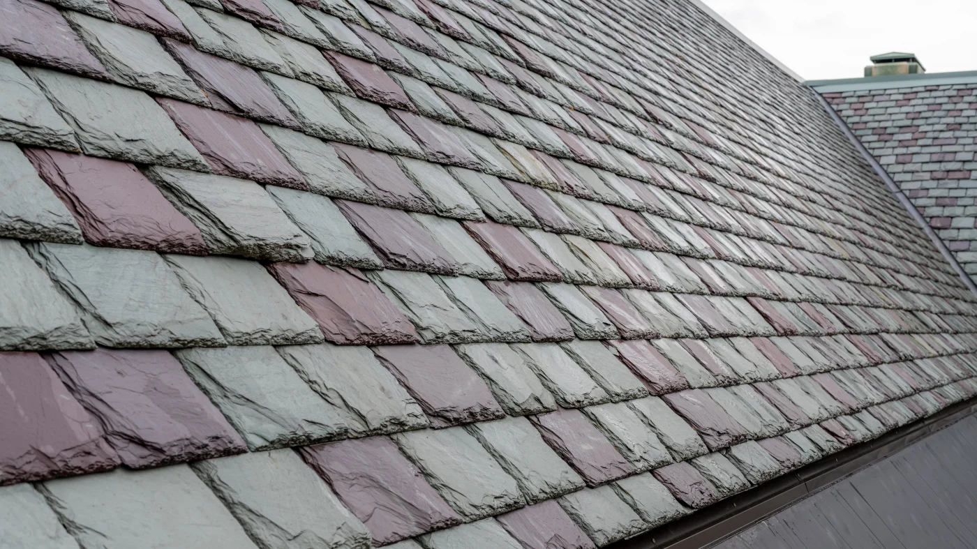 Outstanding Slate Roof Replacement Naperville Il Apex Exteriors Green and red slate tiles on a roof in Naperville, IL by Apex Exteriors