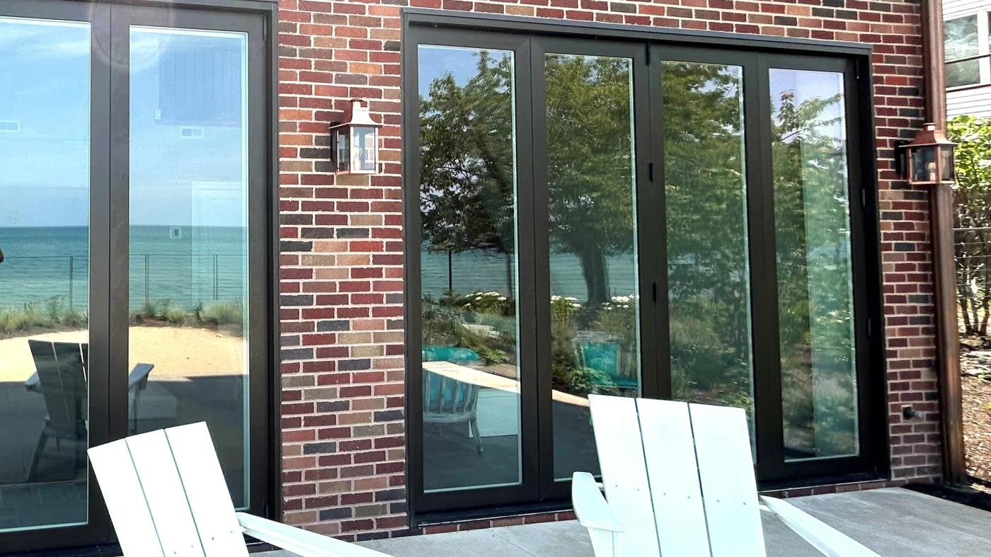 A house with brick siding in Elmhurst, IL by Apex Exteriors.